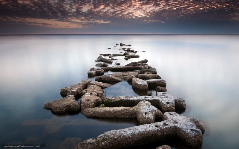 Stone pier at sunset
