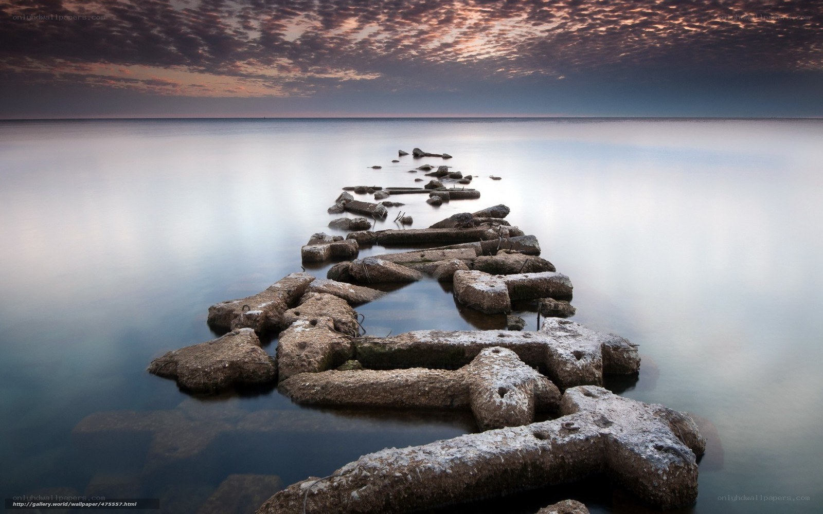 Stone pier at sunset