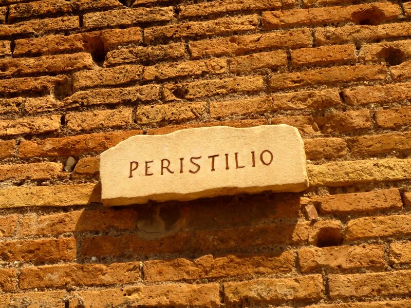 Stone Plaque on Brick Wall — Brown