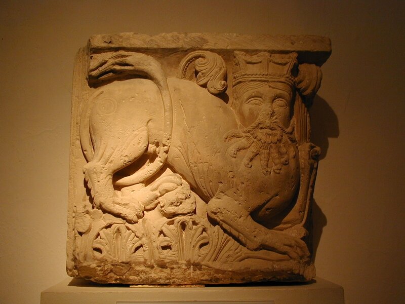 Stone relief of a lion-headed figure