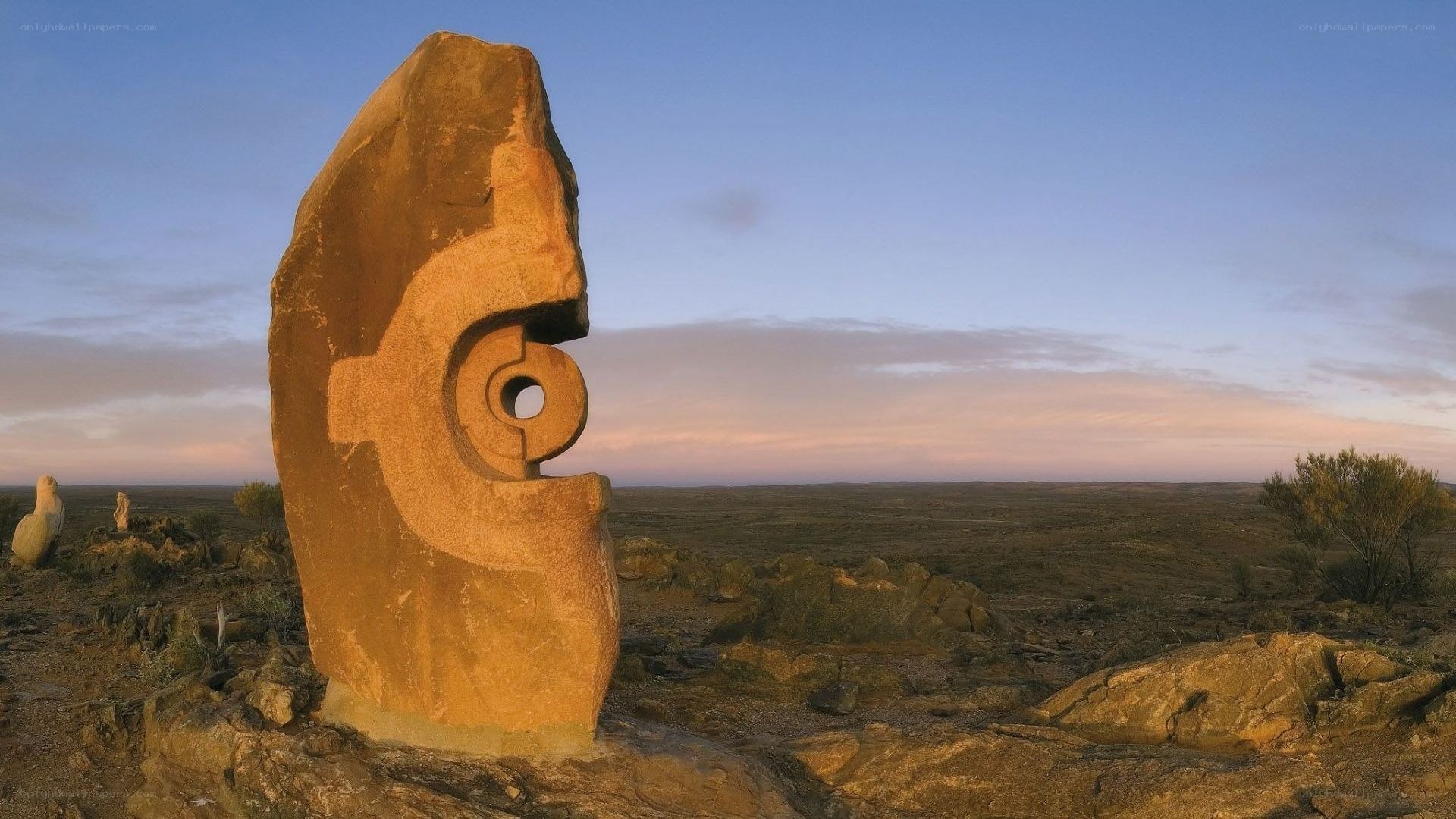 Stone sculpture in desert landscape