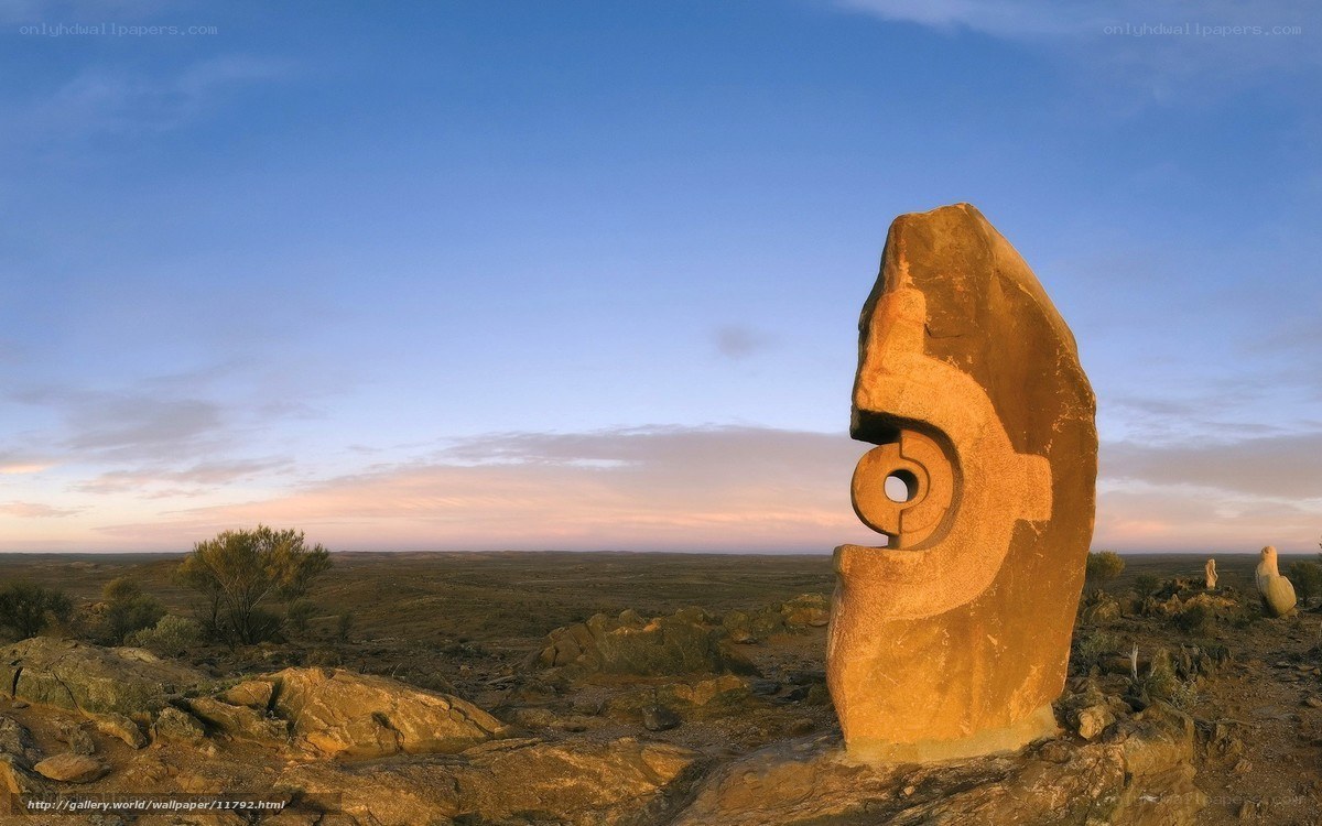 Stone sculpture in desert landscape