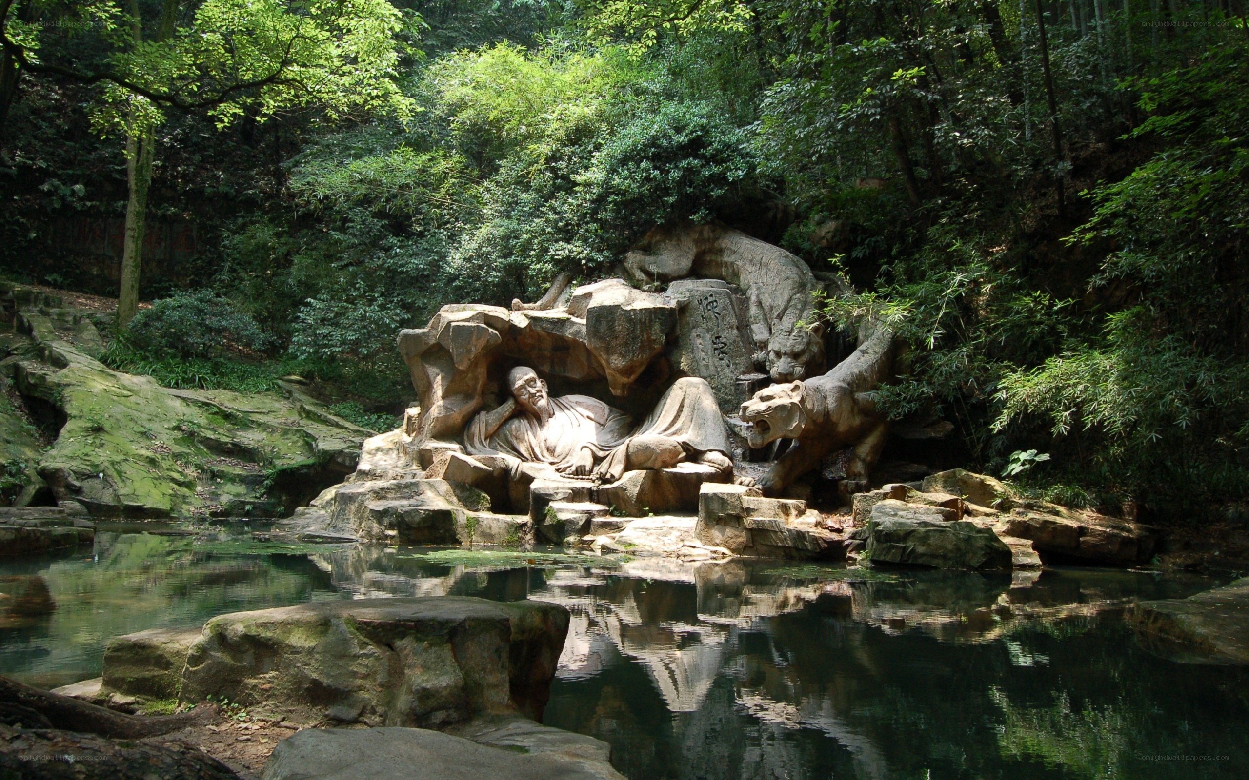 Stone sculpture in forested area