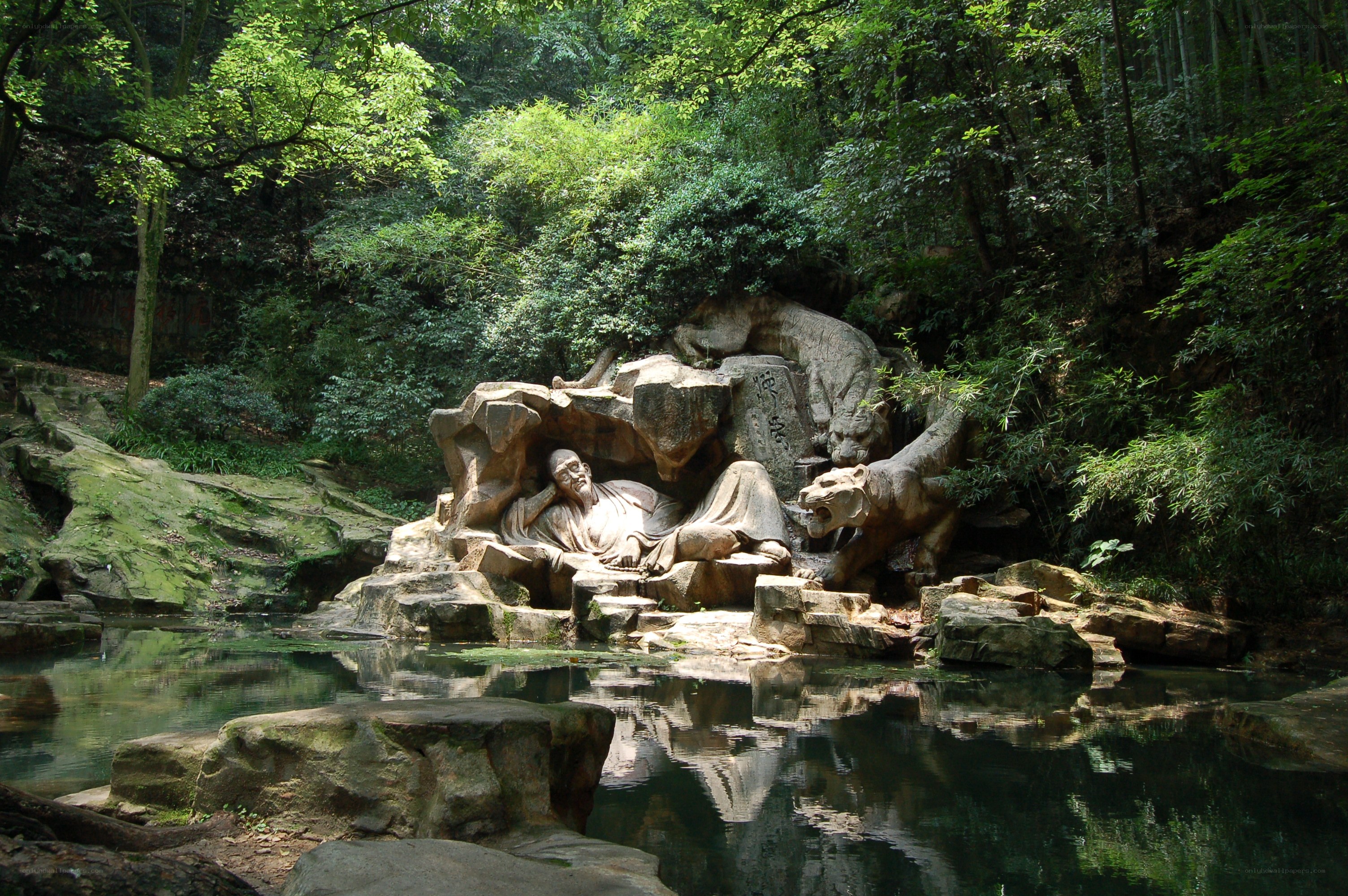 Stone sculpture in forested area