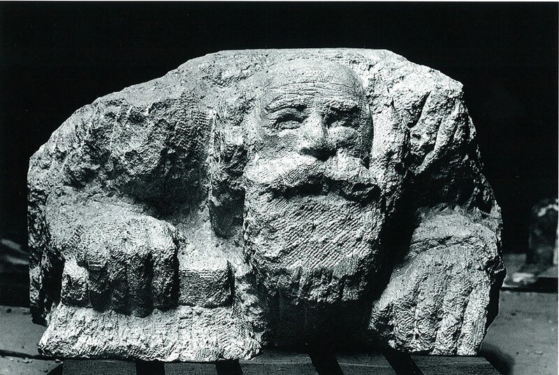 stone sculpture of a bearded man