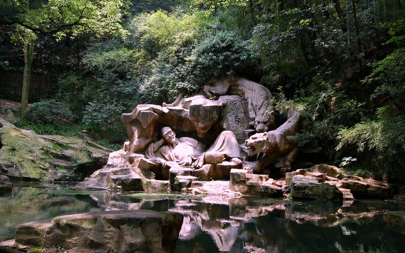 Stone Sculpture of Reclining Man
