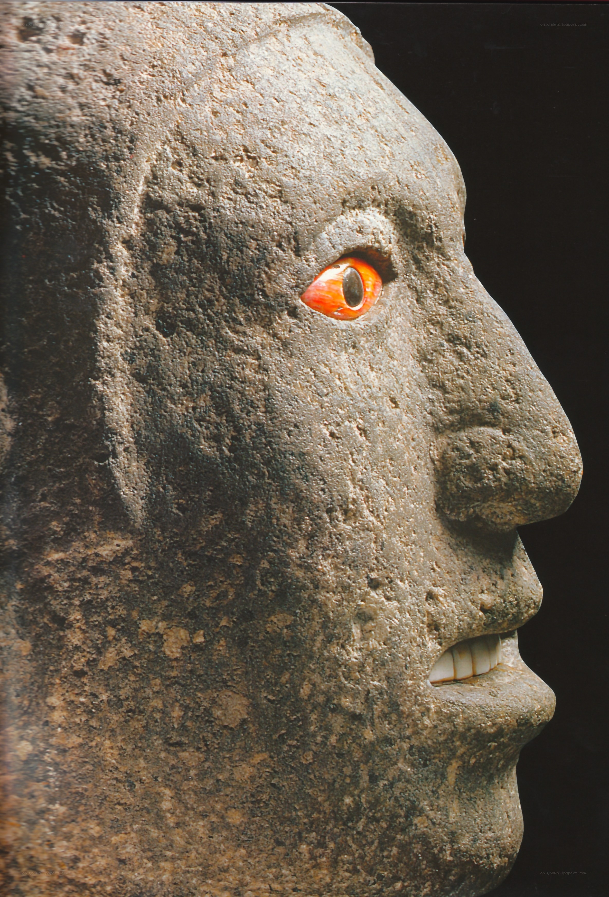 stone sculpture with red eye