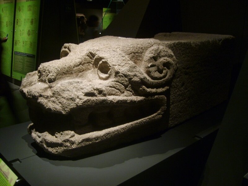 Stone serpent head sculpture