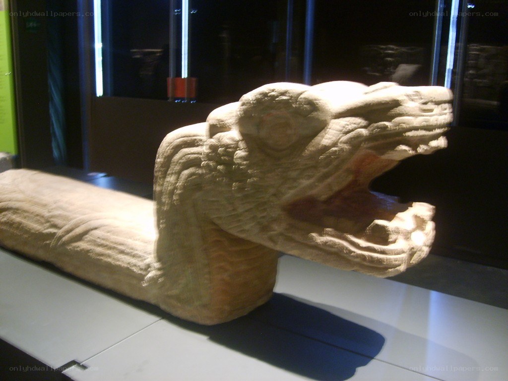 Stone serpent sculpture in museum