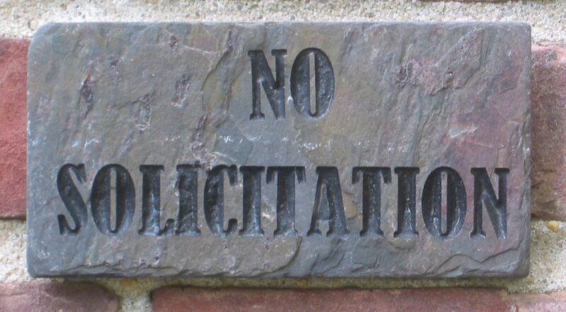 Stone Sign on Brick Wall