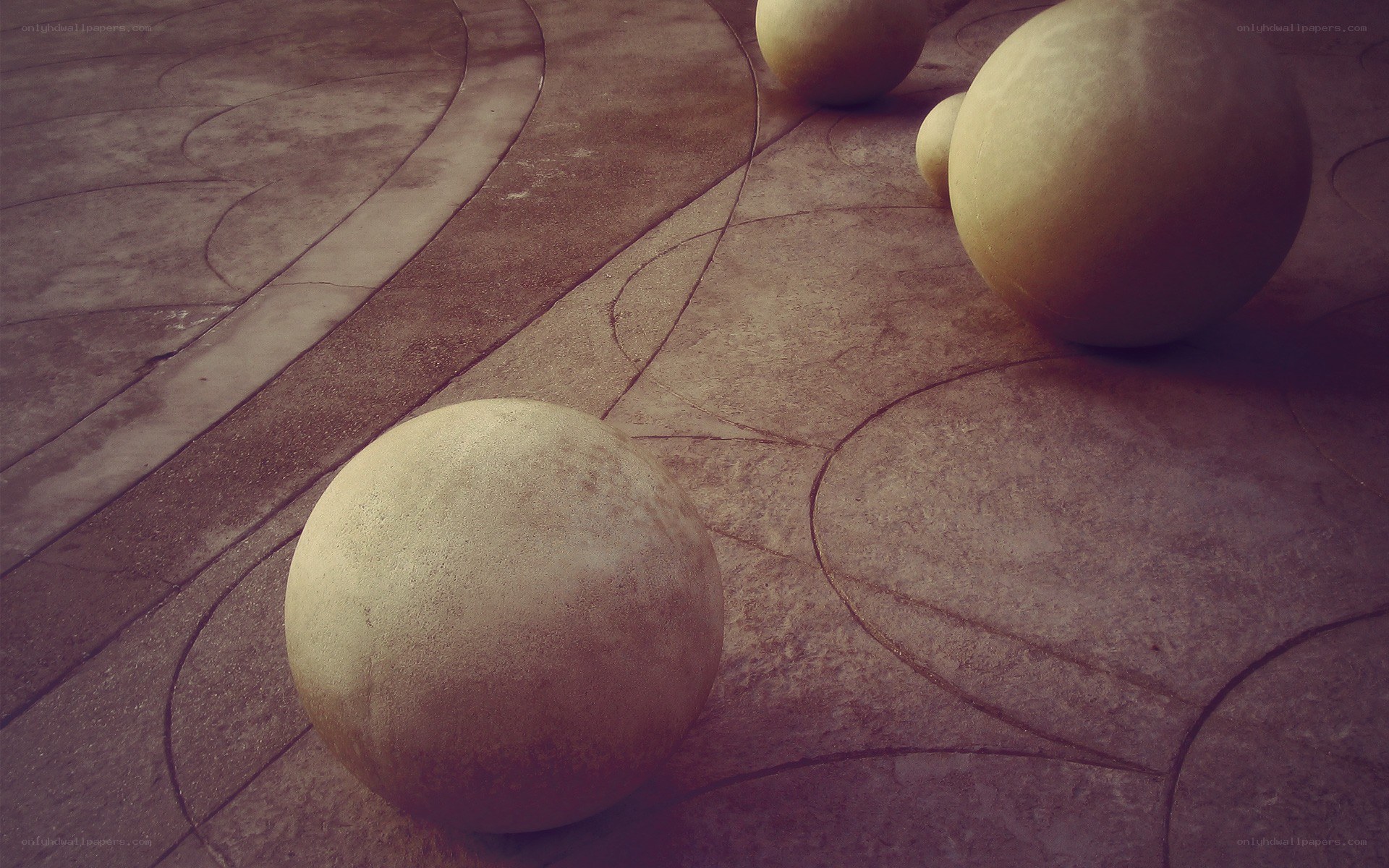 Stone spheres on patterned pavement