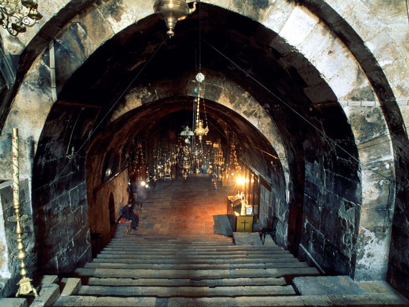 Stone staircase in a church tunnel