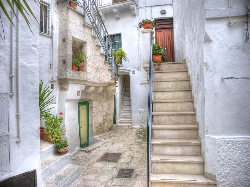 stone staircase in white alley