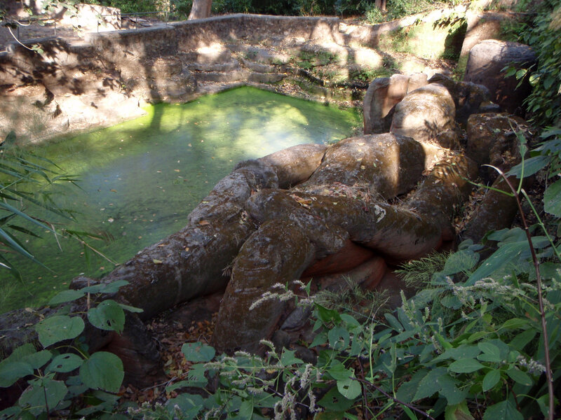 Stone Statue in Pond