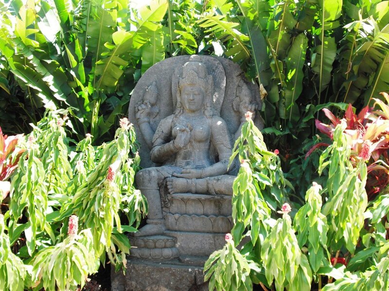 Stone statue in tropical garden
