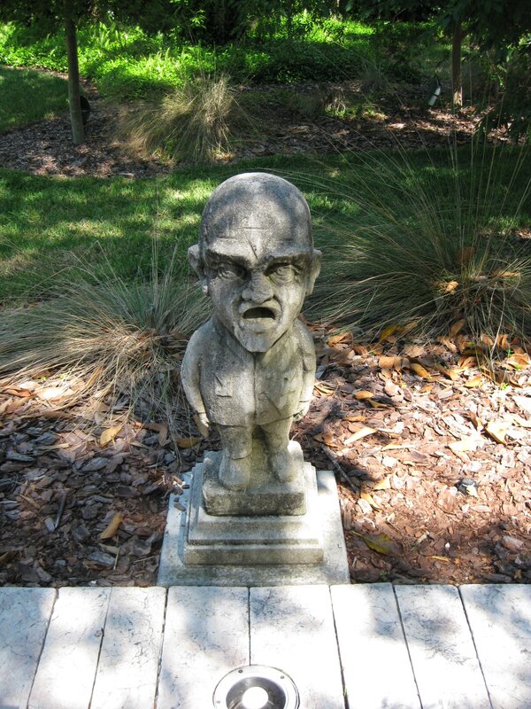 Stone statue of a man in garden