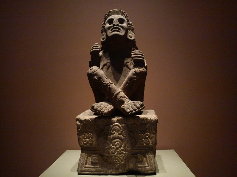 Stone Statue of Seated Figure — Brown