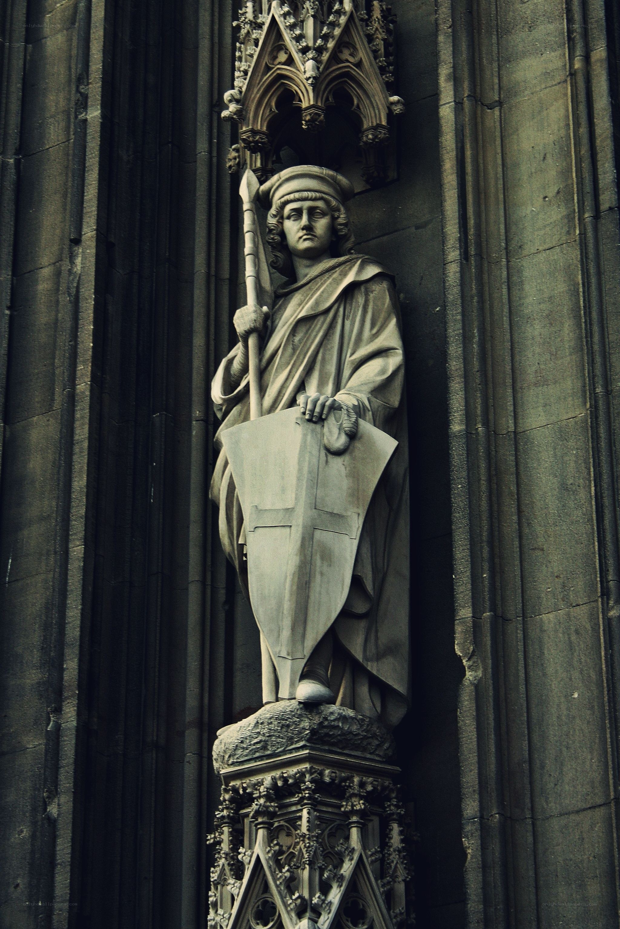 Stone statue on cathedral facade