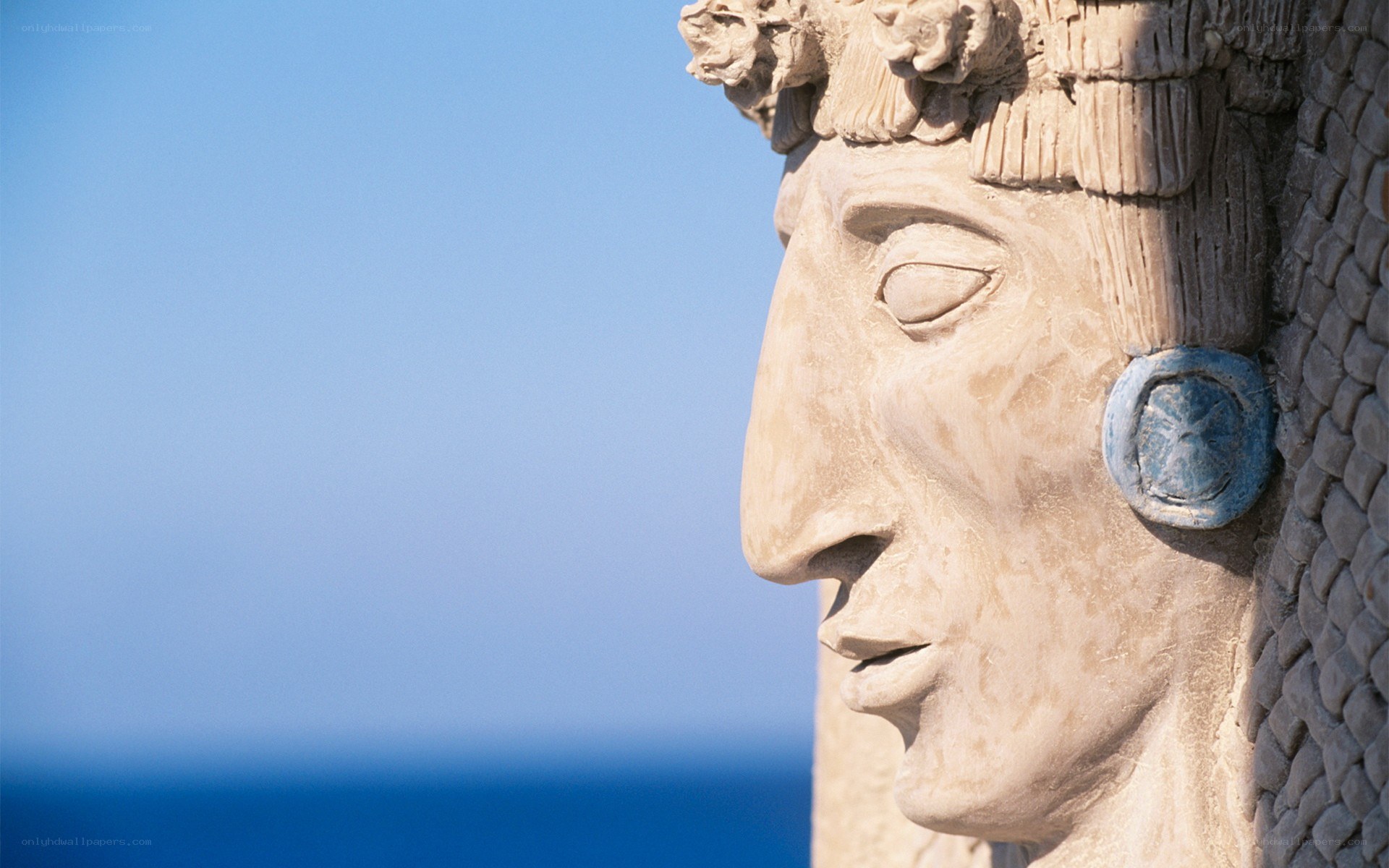 stone statue profile by the sea