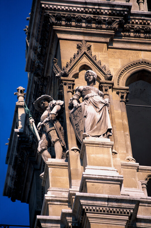 Stone Statues on Building — Beige, Dramatic