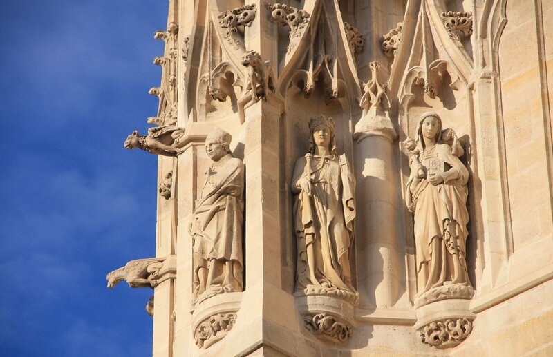 Stone Statues on Building — Beige