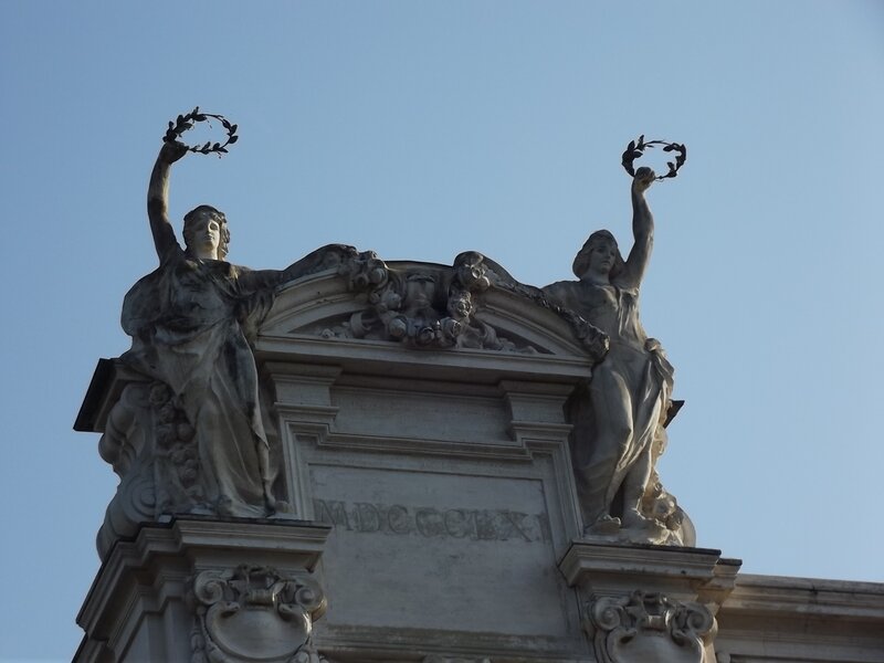 Stone Statues on Building — Gray