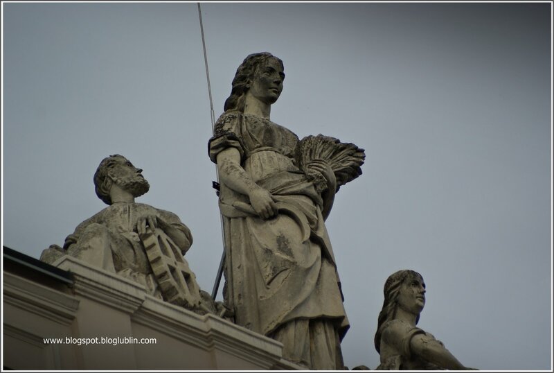stone statues on building