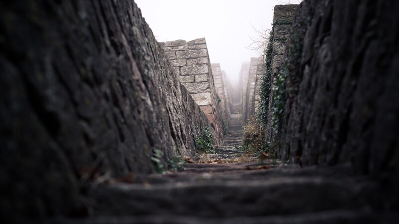 stone steps in foggy alley