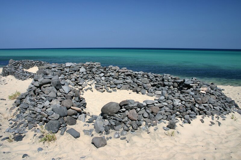Stone structures on a sandy beach