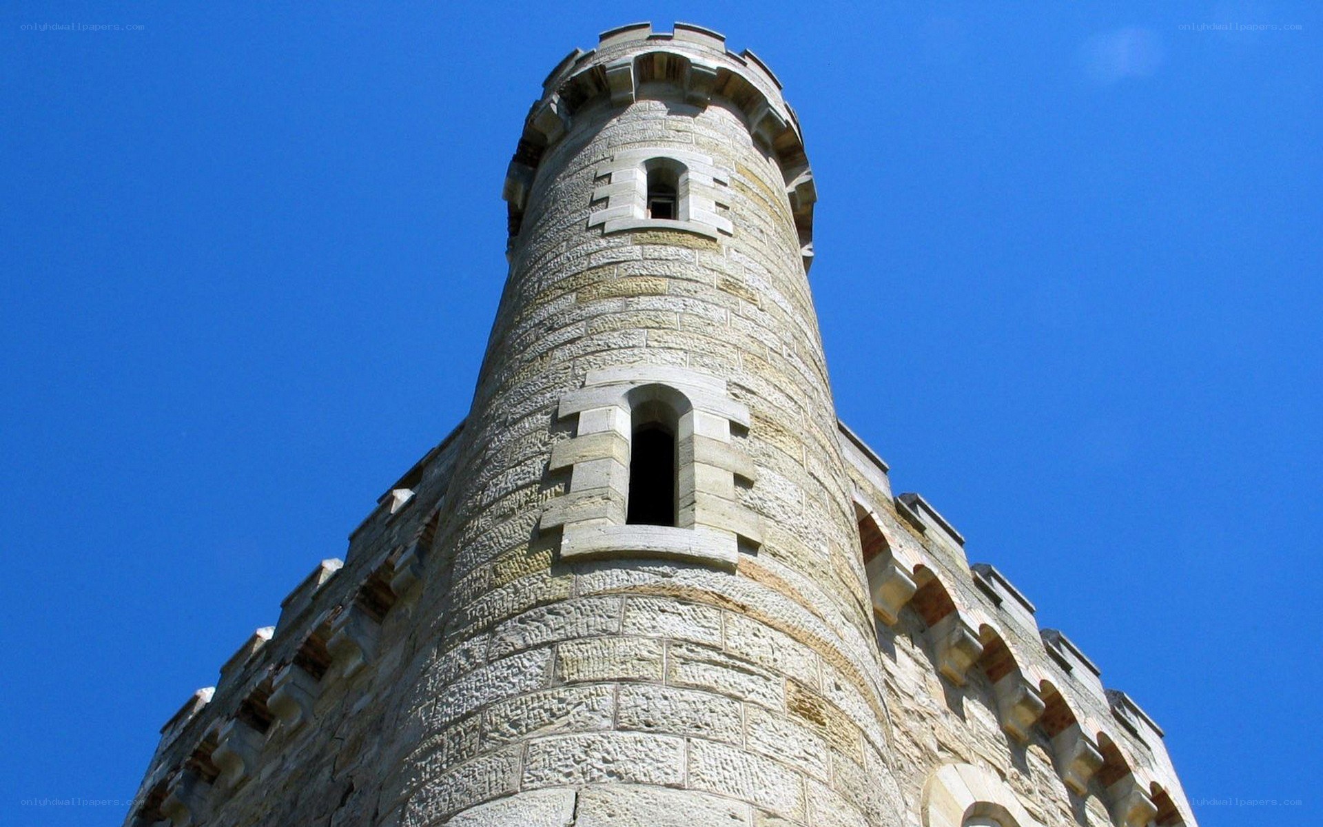 Stone tower against blue sky