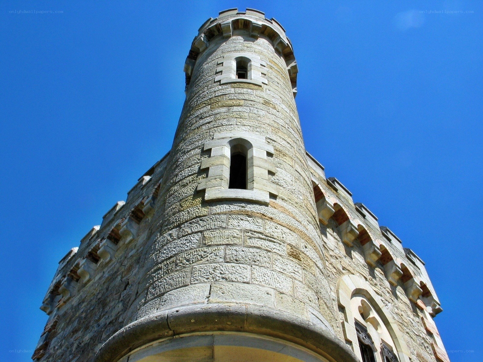 Stone tower against blue sky