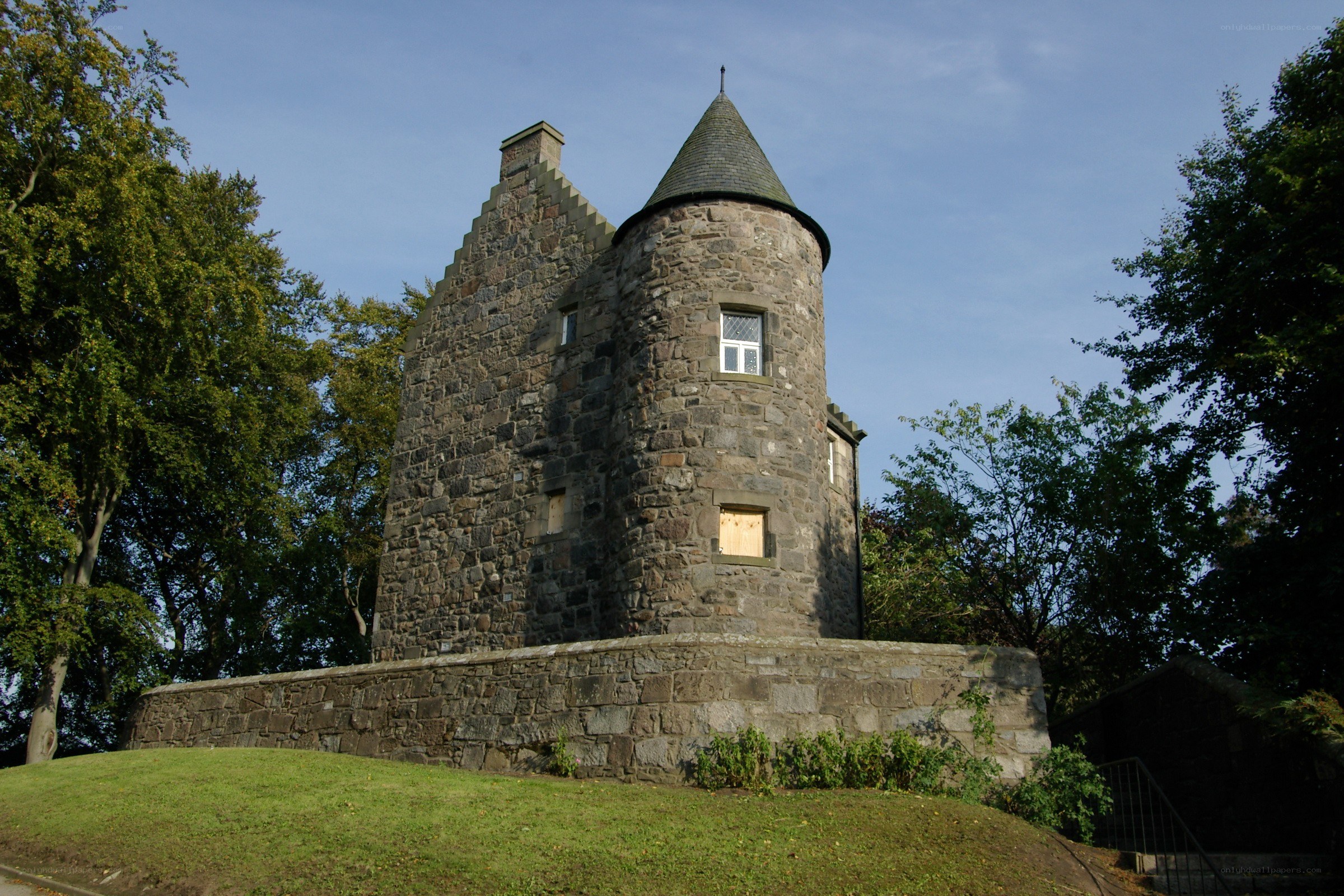 Stone tower on a grassy hill