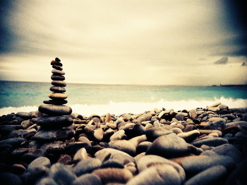 Stone tower on a pebble beach