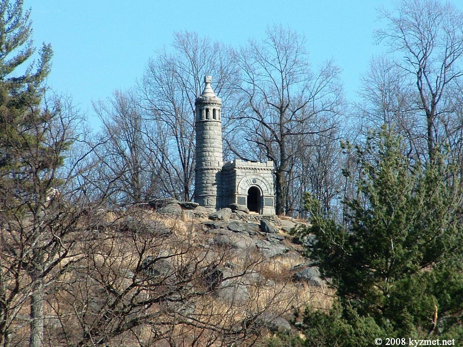 Stone tower on a rocky hill