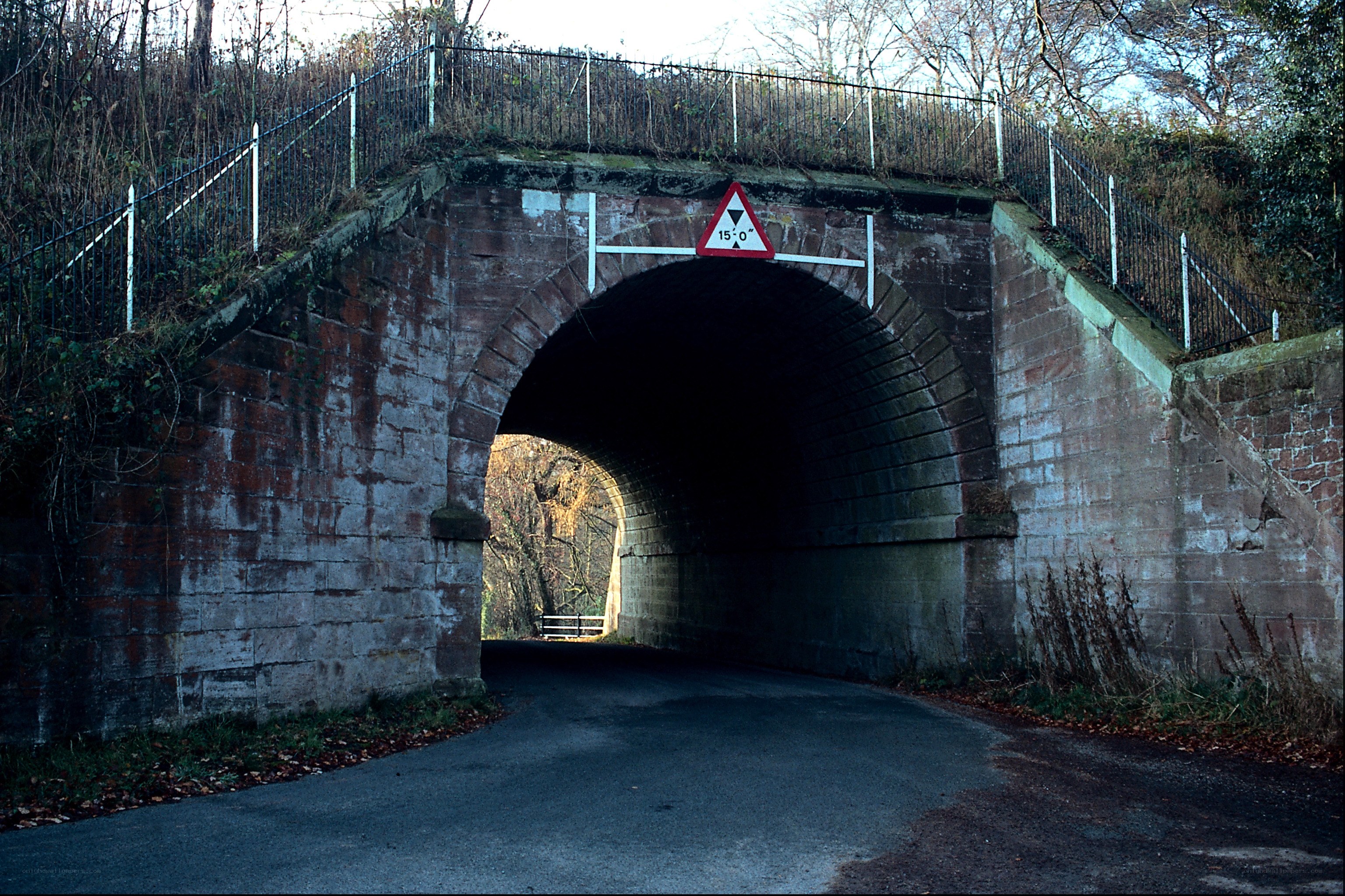 Stone tunnel under railway bridge