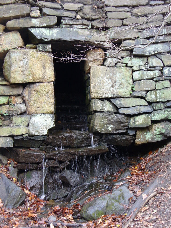 Stone tunnel with waterfall