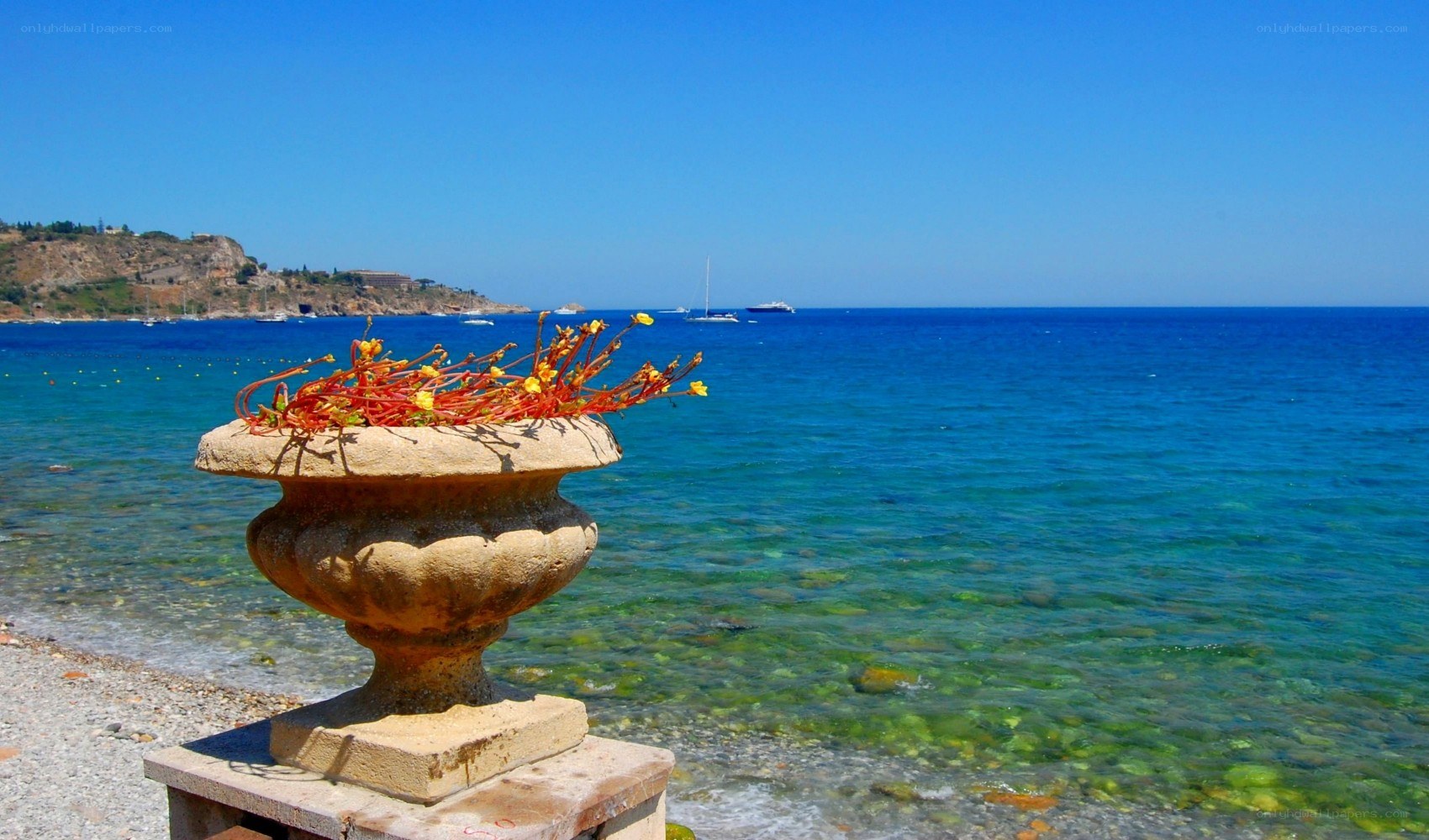 Stone urn by the sea