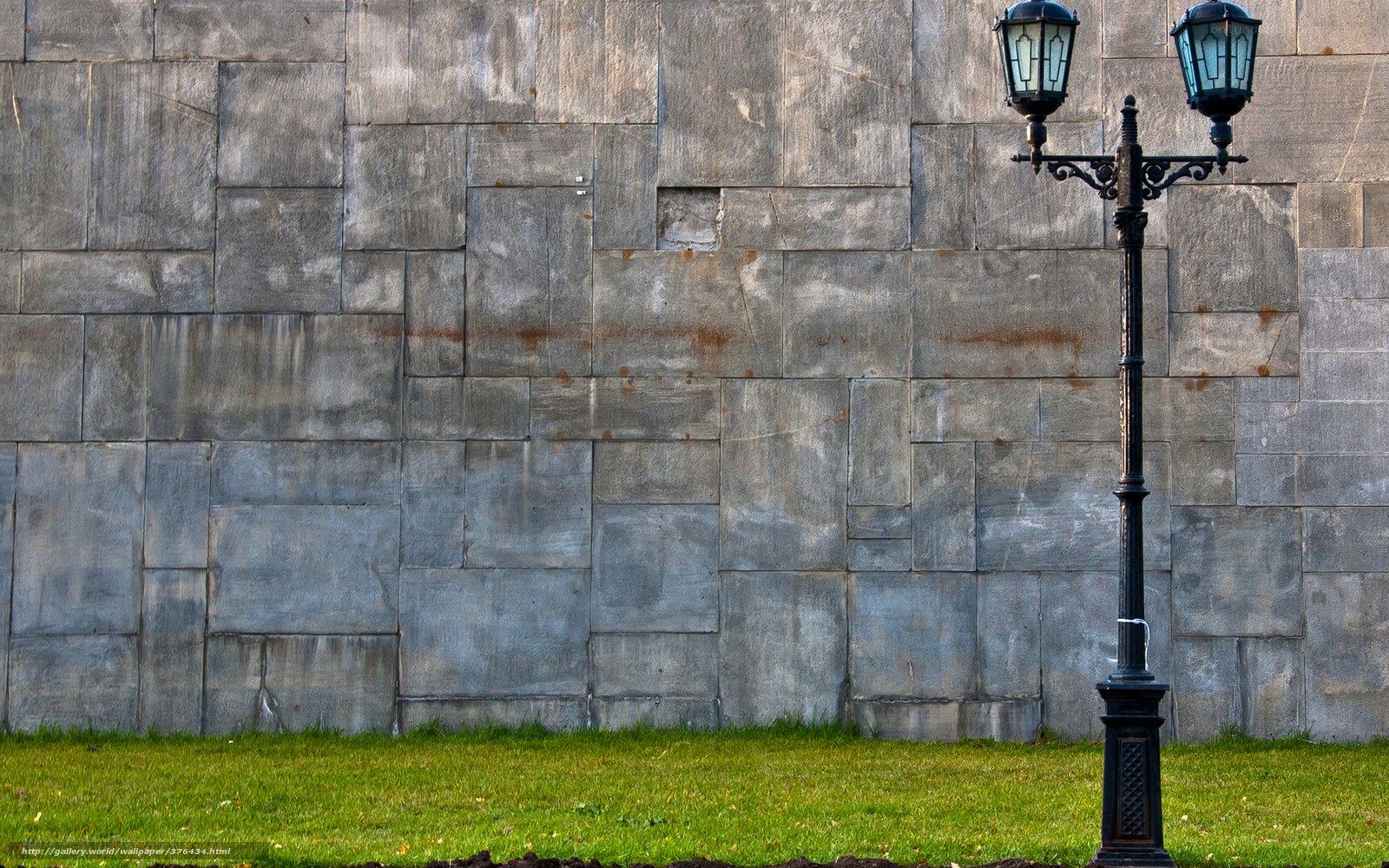 stone wall and lamp post