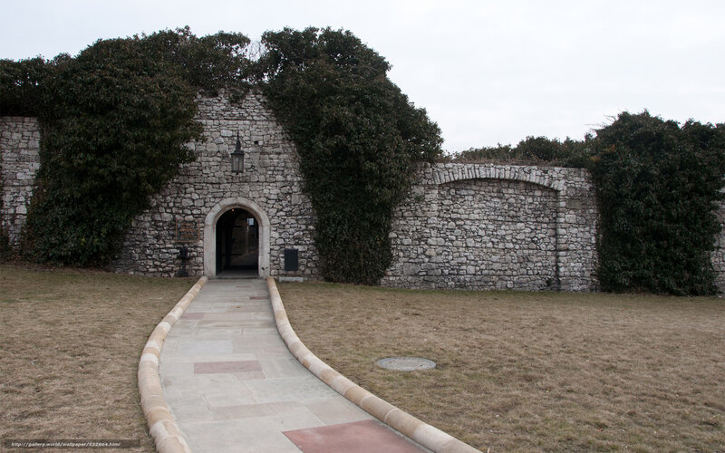 Stone wall entrance with pathway