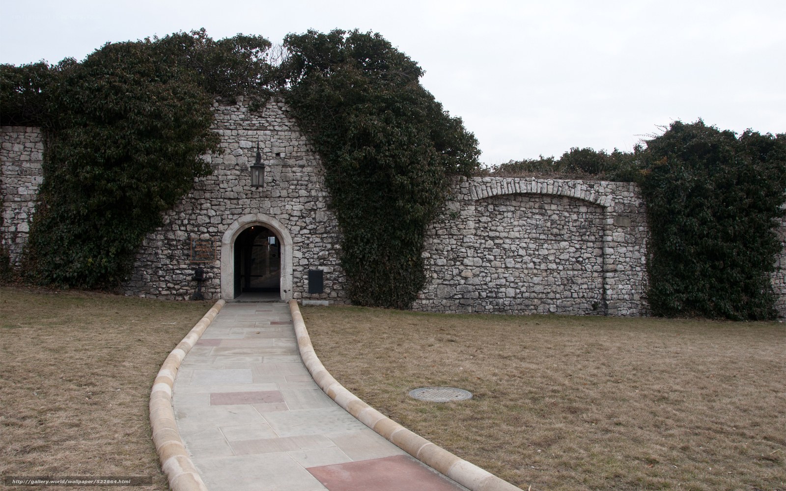 Stone wall entrance with pathway