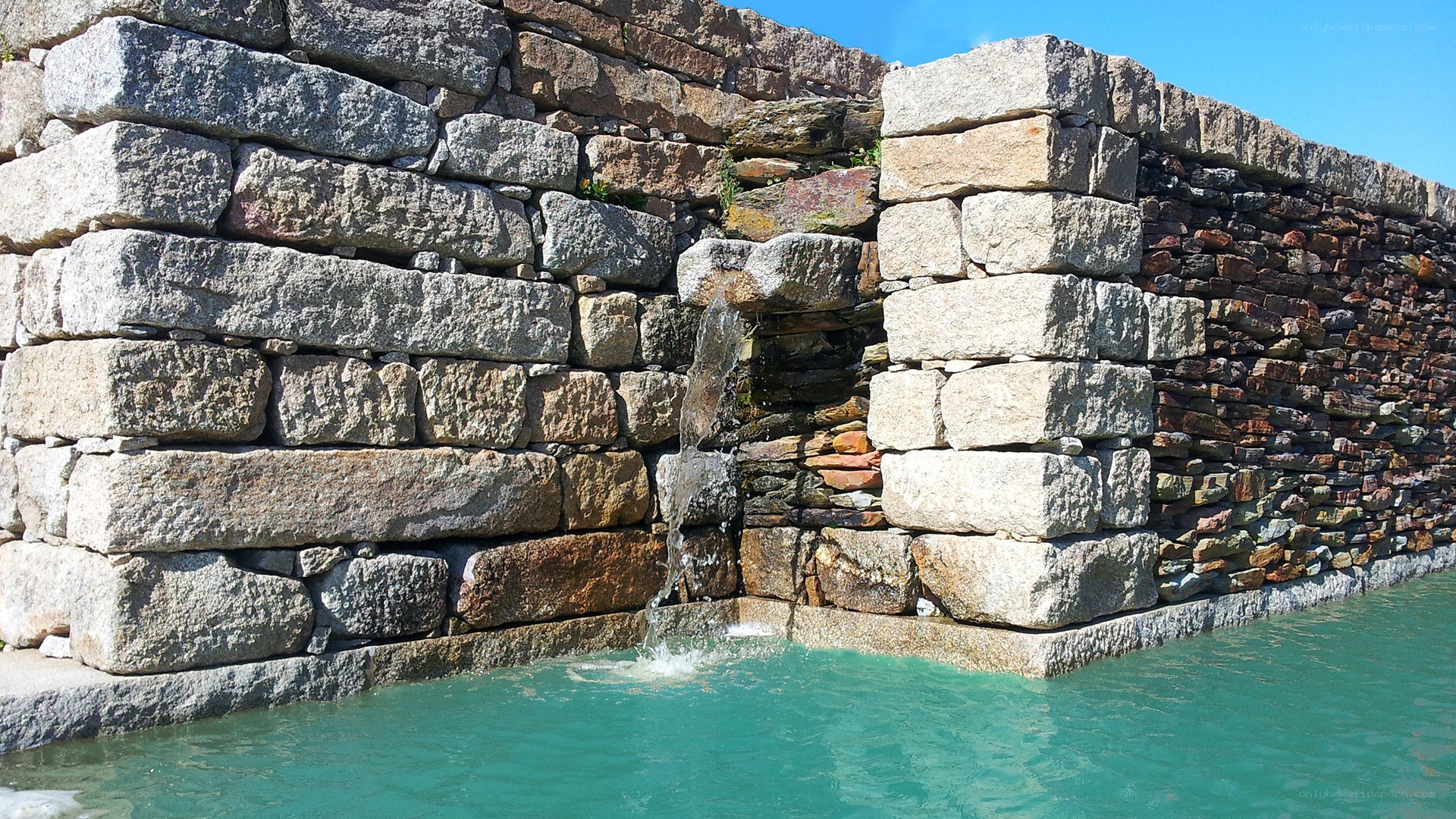 stone wall waterfall feature