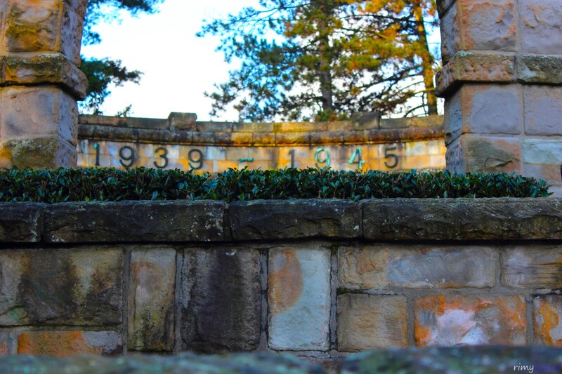 Stone wall with dates and greenery