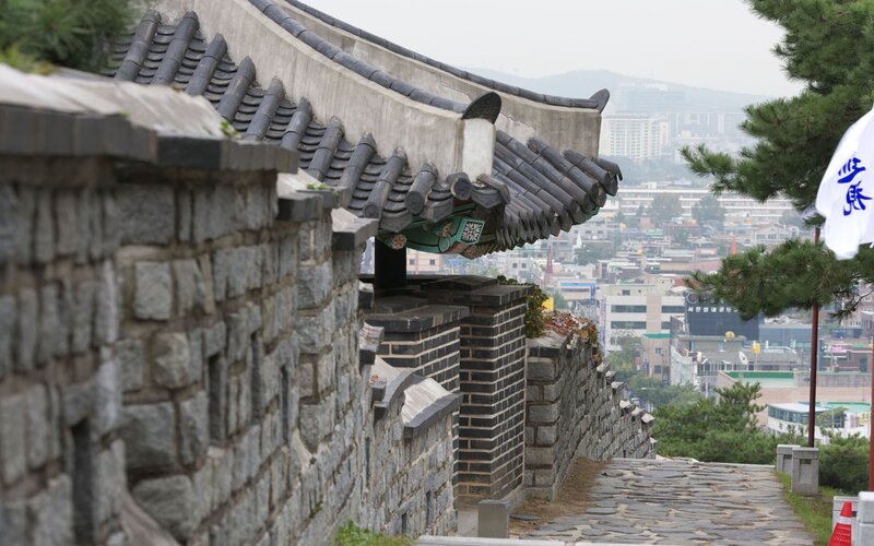 Stone wall with tiled roof