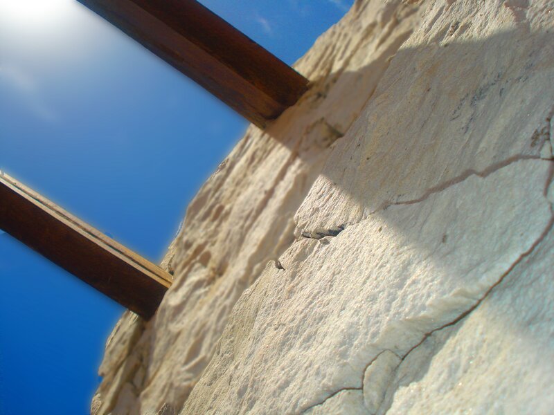 Stone wall with wooden beams