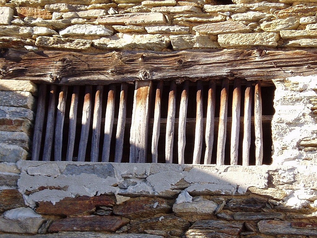stone wall with wooden window