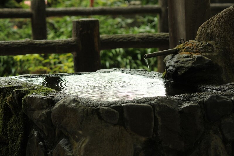stone water basin in garden
