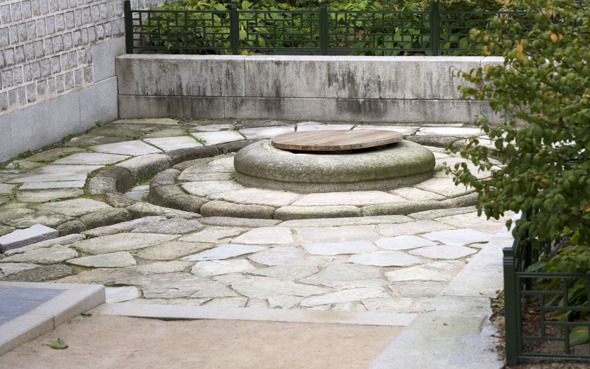 Stone well in garden courtyard