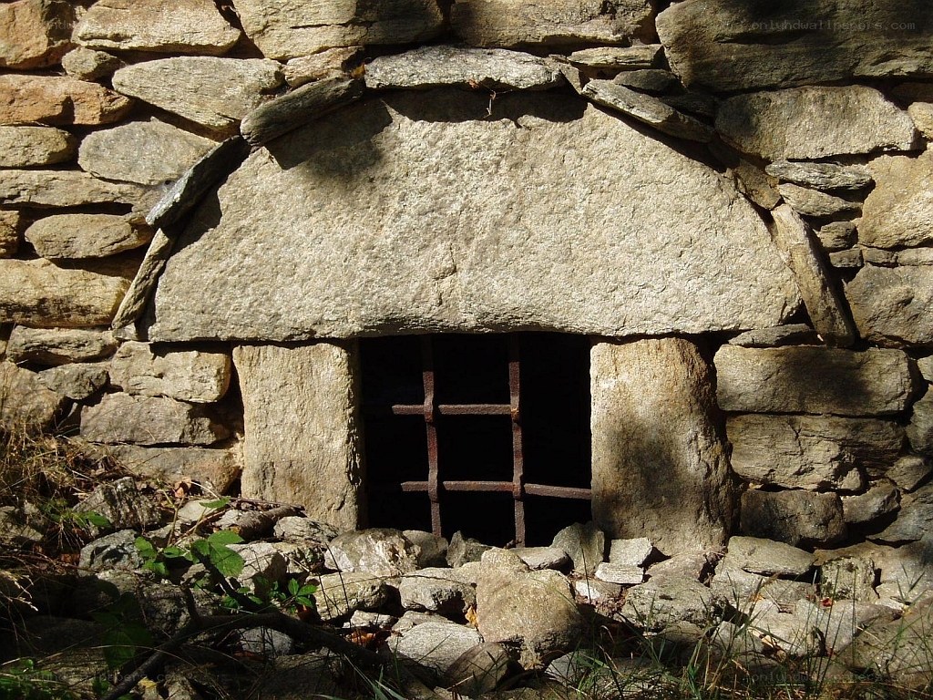 Stone window with iron bars