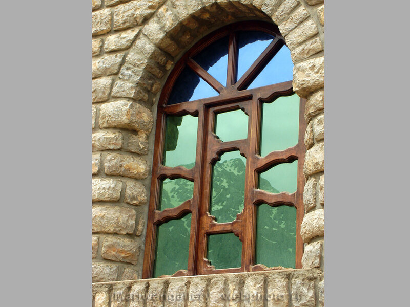 stone window with wooden frame