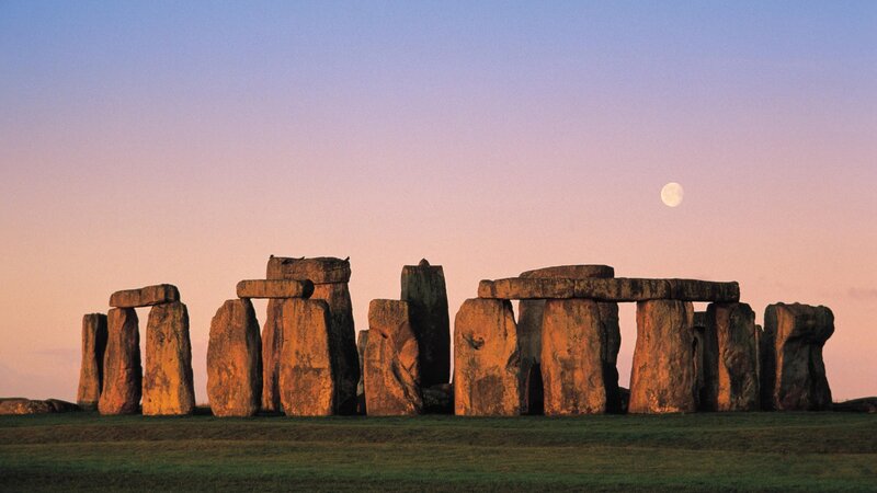 Stonehenge at dusk with moon